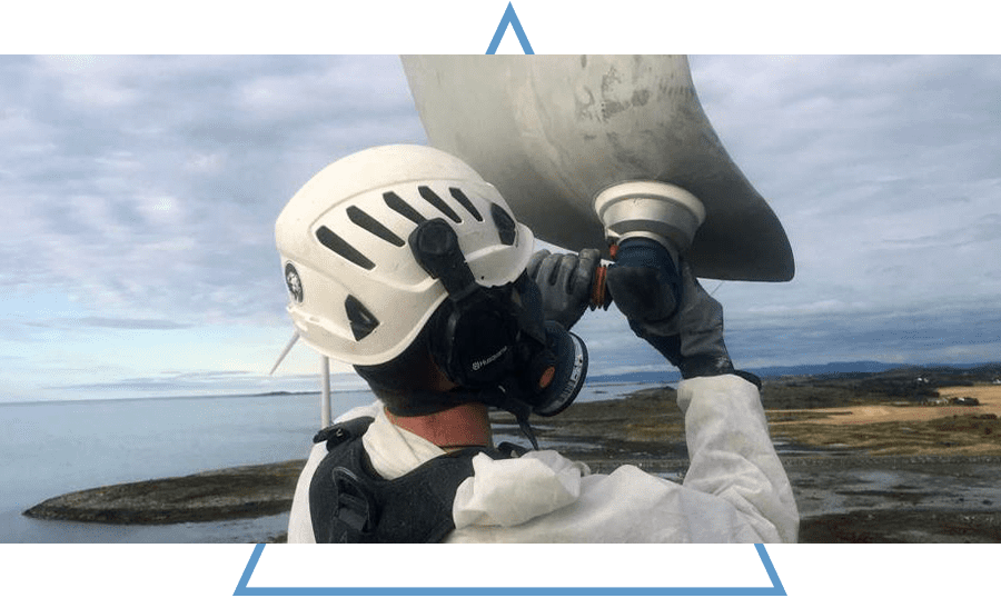 man polishing a wind blade